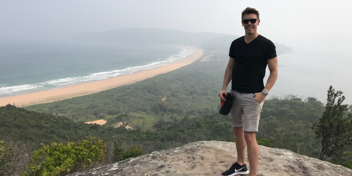 David standing at the peak of palm beach lookout in Sydney Australia